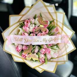 Pink and white tulip bouquet with a "Will You Be My Girlfriend?" ribbon