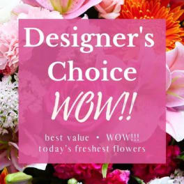 Pink sign over a colorful bouquet of mixed flowers