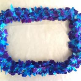 Blue and purple flower lei arranged in a rectangular frame