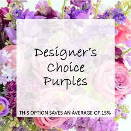Purple floral arrangement with pink roses and mixed blooms
