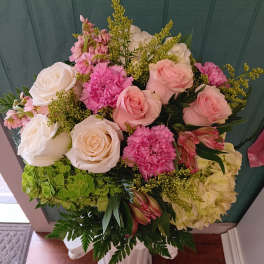 Bouquet of pink and white roses with carnations and hydrangeas