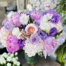 Bouquet of pink, lavender, and white flowers in a vase