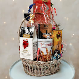 Basket of assorted chocolates and candy with candy canes