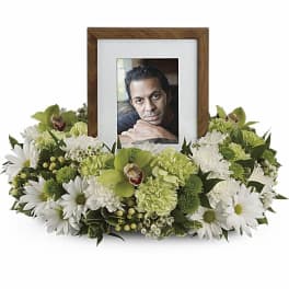 Floral photo frame arrangement with white and green flowers