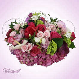 Mixed pink and red rose bouquet with hydrangeas and green accents