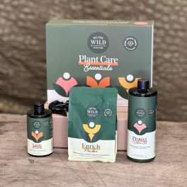 Plant care gift set with three bottles and a pouch in front of a box