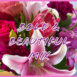 Mixed bouquet with pink lilies, roses, and orchids