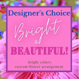 Pink flower arrangement with a designer's choice sign