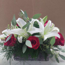 Wood grain box of red & white flowers