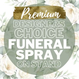 Floral funeral spray on stand with white roses and greenery