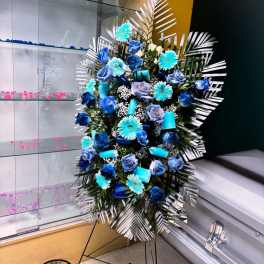 Blue and white floral standing spray on an easel