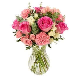Pink and peach mixed bouquet in a clear glass vase