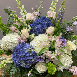 Large bouquet of blue hydrangeas, white roses, and pink alstroemeria