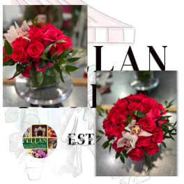 Compact arrangement of hot pink roses with pale pink orchids in a clear glass cube vase