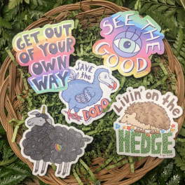 Sticker set on a wicker tray over fern leaves