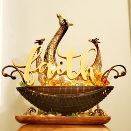 Decorative faith sign with giraffe figures and small orange flowers