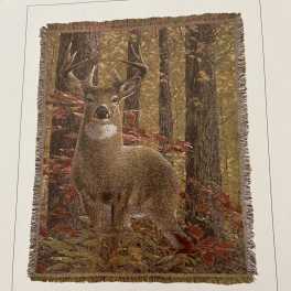 Fringed wall hanging with a deer in an autumn forest