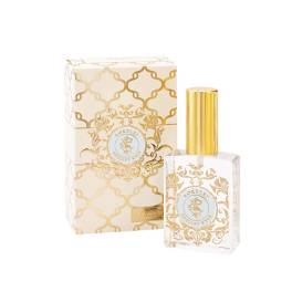 Perfume bottle with gold cap beside matching decorative box
