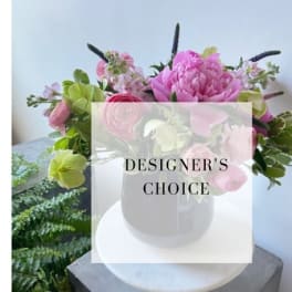 Pink and green mixed bouquet in a white vase