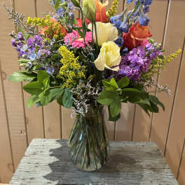 Colorful mixed bouquet in a clear glass vase