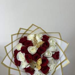 Bouquet of red and white roses with gold butterfly accents
