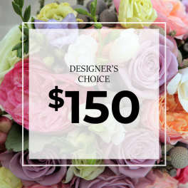 Graphic over pastel rose arrangement reading Designer's Choice $150