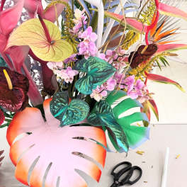 Tropical arrangement with orchids and colorful anthuriums