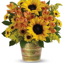 Sunflower and orange alstroemeria bouquet in a striped ceramic pot