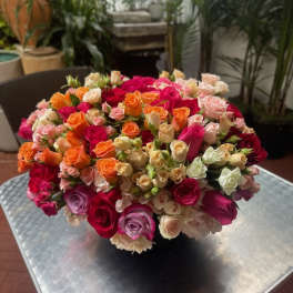 Large bouquet of multicolored roses on a table