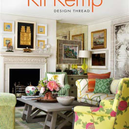 Decorated living room with floral accents and patterned chairs