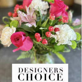 Pink and white mixed bouquet with roses and carnations in a vase