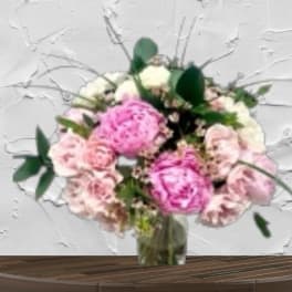 Pink and white bouquet in a glass vase