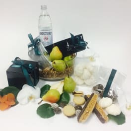 Gift basket with pears, cookies, chocolates, and white orchids