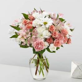Pink and white mixed bouquet in a clear glass vase