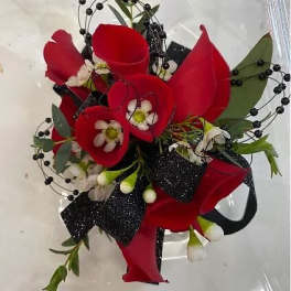 Red calla lily bouquet with black berry accents and ribbon