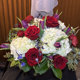 Bouquet of red roses, white hydrangeas, and purple tulips