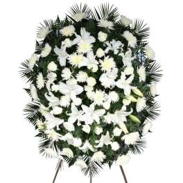 White floral standing spray on an easel