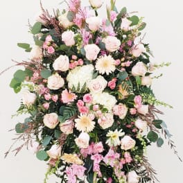 Standing floral spray with pale pink roses and gerbera daisies