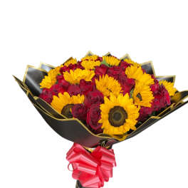Bouquet of red roses and yellow sunflowers wrapped in black paper with a pink bow