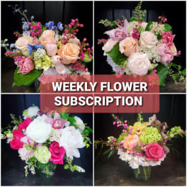 Four mixed flower bouquets with roses and orchids in glass vases