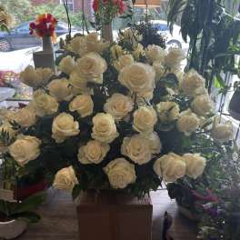 Large bouquet of cream roses arranged in a box
