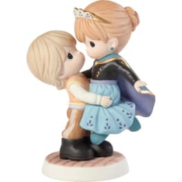 Two figurines in a close embrace on a round base