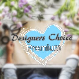 Blurred floral workspace with a "Designers Choice Premium" heart graphic