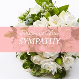 White rose bouquet with green berries and foliage