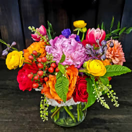 Colorful mixed bouquet in a clear glass vase