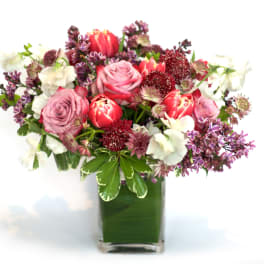 Pink and white mixed bouquet in a clear glass vase