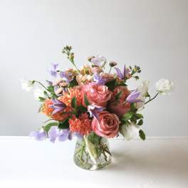 Pink and lavender mixed bouquet in a clear glass vase