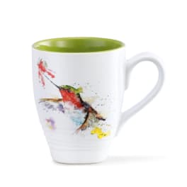 White mug with a colorful hummingbird illustration and green interior