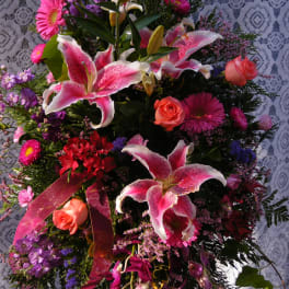 Pink and white lily bouquet with roses and purple flowers