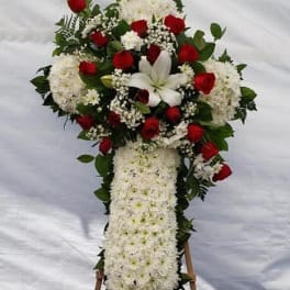 Standing floral spray with red roses, white lilies, and white chrysanthemums